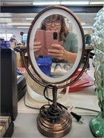 Lighted magnifying mirror