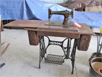 Singer treadle sewing machine in cabinet