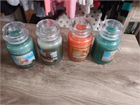 4 large Yankee candles and jars new.