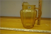 Amber colored glass water pitcher