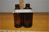 3 small brown vintage bottles