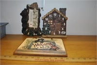 clock, thermometer and welcome to the woods sign