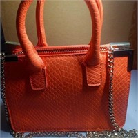 Orange handbag with shoulder strap