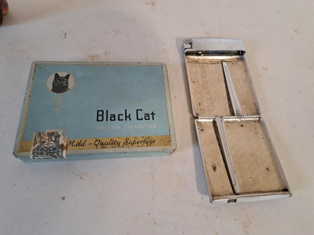 Black Cat tin and cigarette holder with lighter