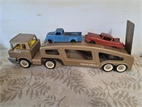 Vintage Structo car carrier with 2 cars