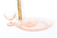 Three pieces of pink depression glass dishes