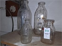 Two vintage alwin milk bottles, one 4oz ovals