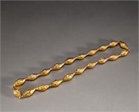 Qing Dynasty 18K gold bag cinnabar cylinder beads