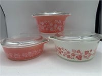 Pink and white Pyrex dishes with lids