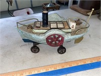 Heavy toy boat with old metal cast wheels