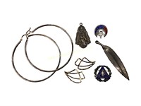 Sterling pins, pendants, hoop earrings. 21 grams