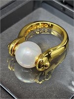 UNO de 50 / ITALY GOLD-TONE PEARL SPINNER RING SZ.