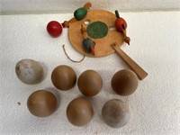 Wooden chicken paddle toy & 7 wooden eggs.