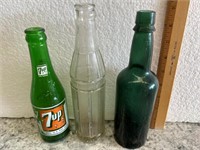 Antique soda pop bottles. 7-UP.