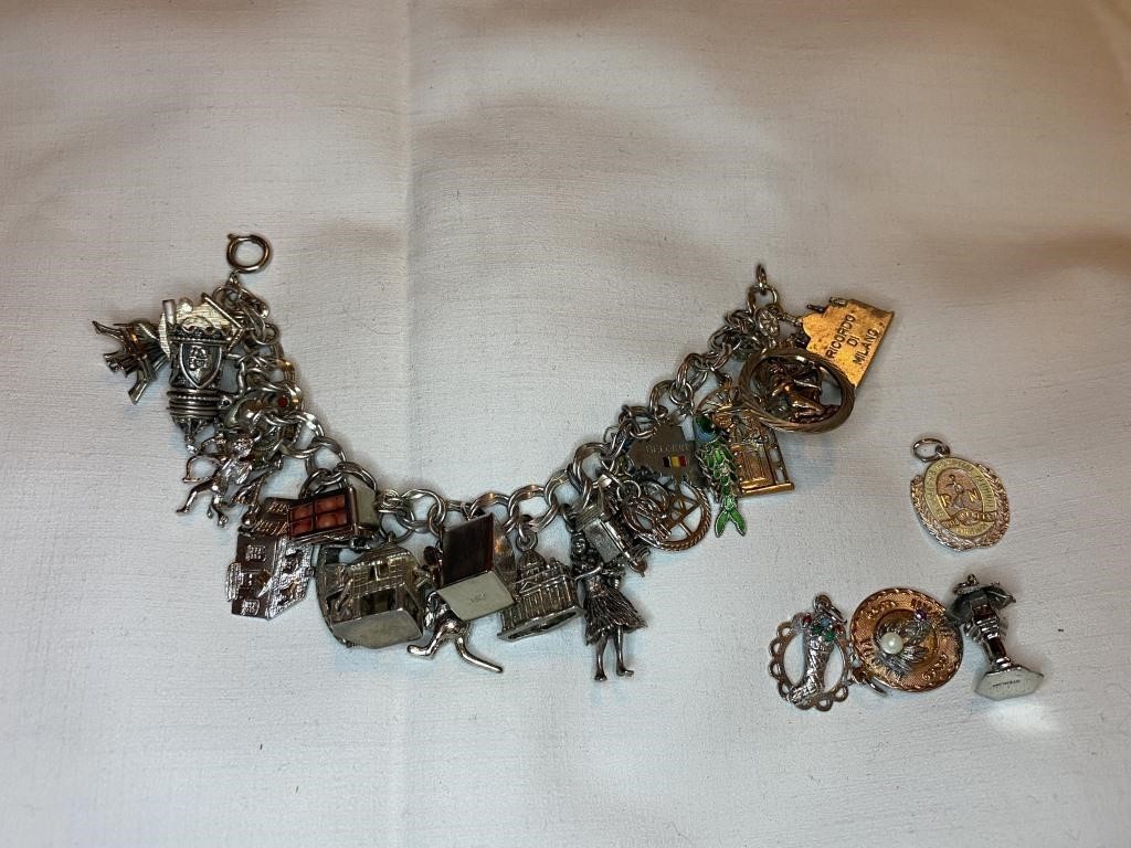 Charm bracelet, some charms stamped sterling