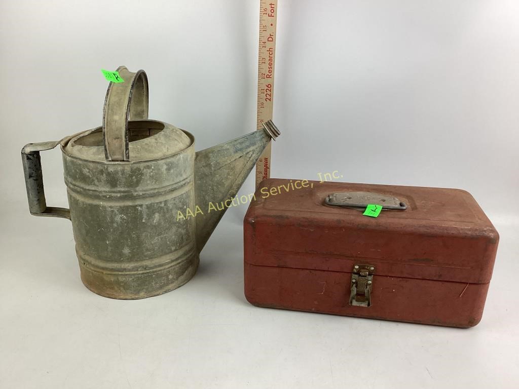 Galvanized watering can missing the spout and a