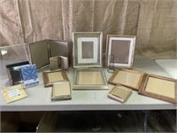 Large assortment of picture frames.