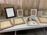 Assortment of picture frames and picture of Jesus