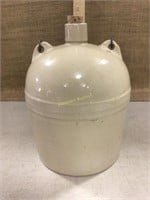 Stoneware jug with bail handle.