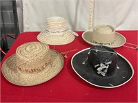 4 hats. 3 boys cowboy hats, one ladies basket hat.