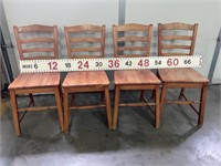 Set of four Richardson Bros wood straight chairs.