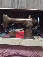 Early New Home sewing machine in case