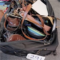 LARGE SUITCASE WITH ASSORTED BELTS