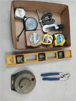 Man tools tape measures, level, hex bits, c
