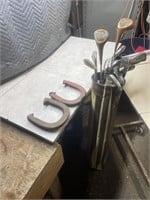 Miscellaneous left-hand golf clubs in a bag