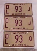 Three 1986 Illinois embossed metal dealer license
