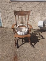 Vintage pressed back wooden rocking chair