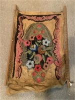 Early latch hook rug on frame
