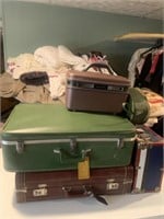 Empty suitcases and skate case