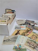 Box of unsorted postcards