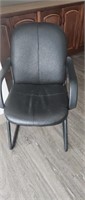 Black chair located upstairs
