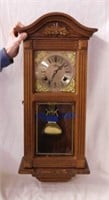 Key wind oak wall clock with pendulum,