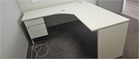 L-shaped desk located upstairs