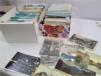 2 boxes of foreign postcards- most unused