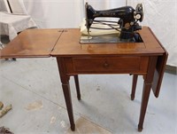 Singer sewing machine and cabinet w/accessories