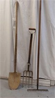 One shovel pitchfork and rake.
