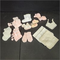Assorted knitted and crocheted baby clothes