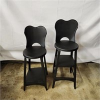 2 child-size black metal stools