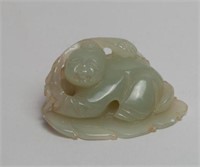 Chinese jade carving boy on the leaf