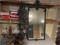 Heavy metal mirror, vintage sconces, and wall