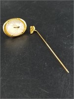 18kt Gold nugget on a pin, and a lapel pin with an