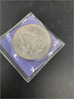 1885 O Morgan silver dollar, condition is AU50 or