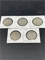 Five Walking Liberty silver half dollars