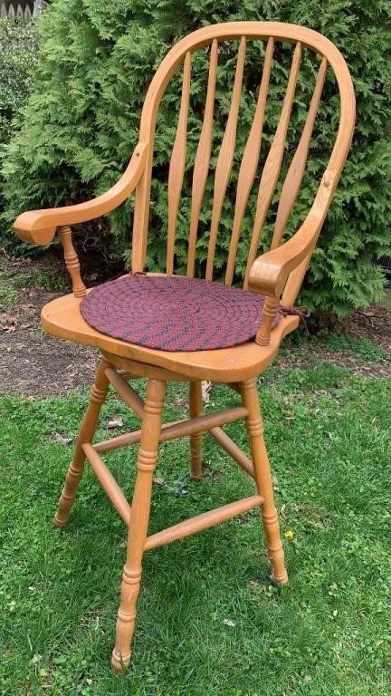 Tall oak swivel chair