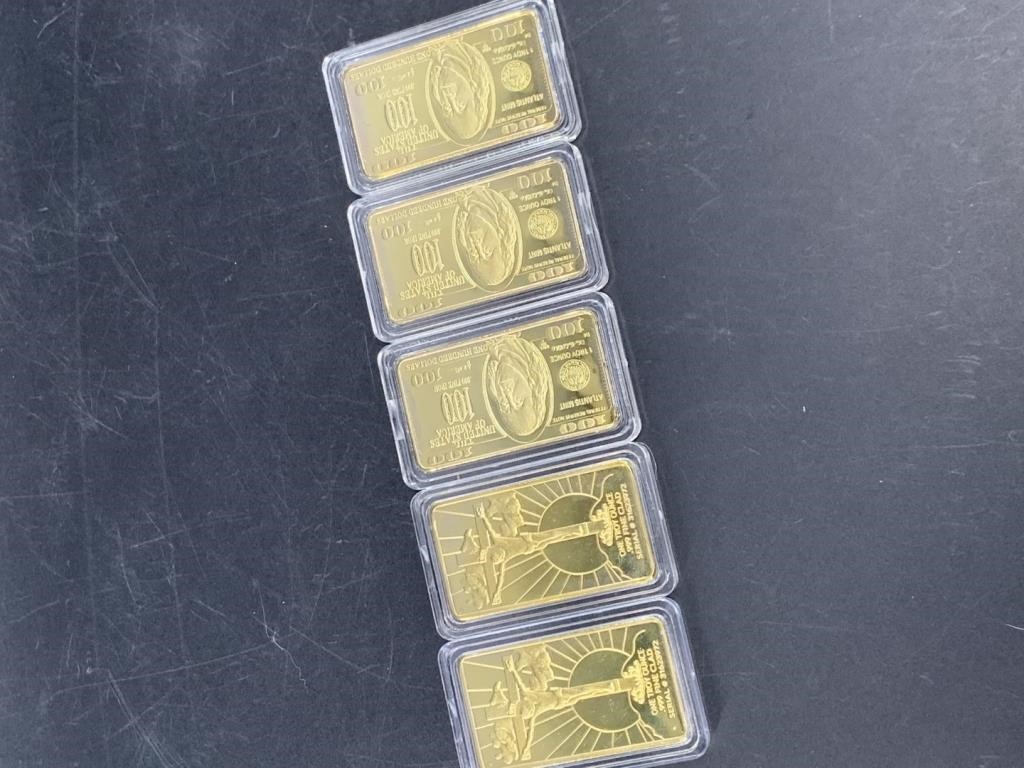 Five gold plated bars