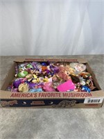 Assortment of mini toy dolls, ranging from